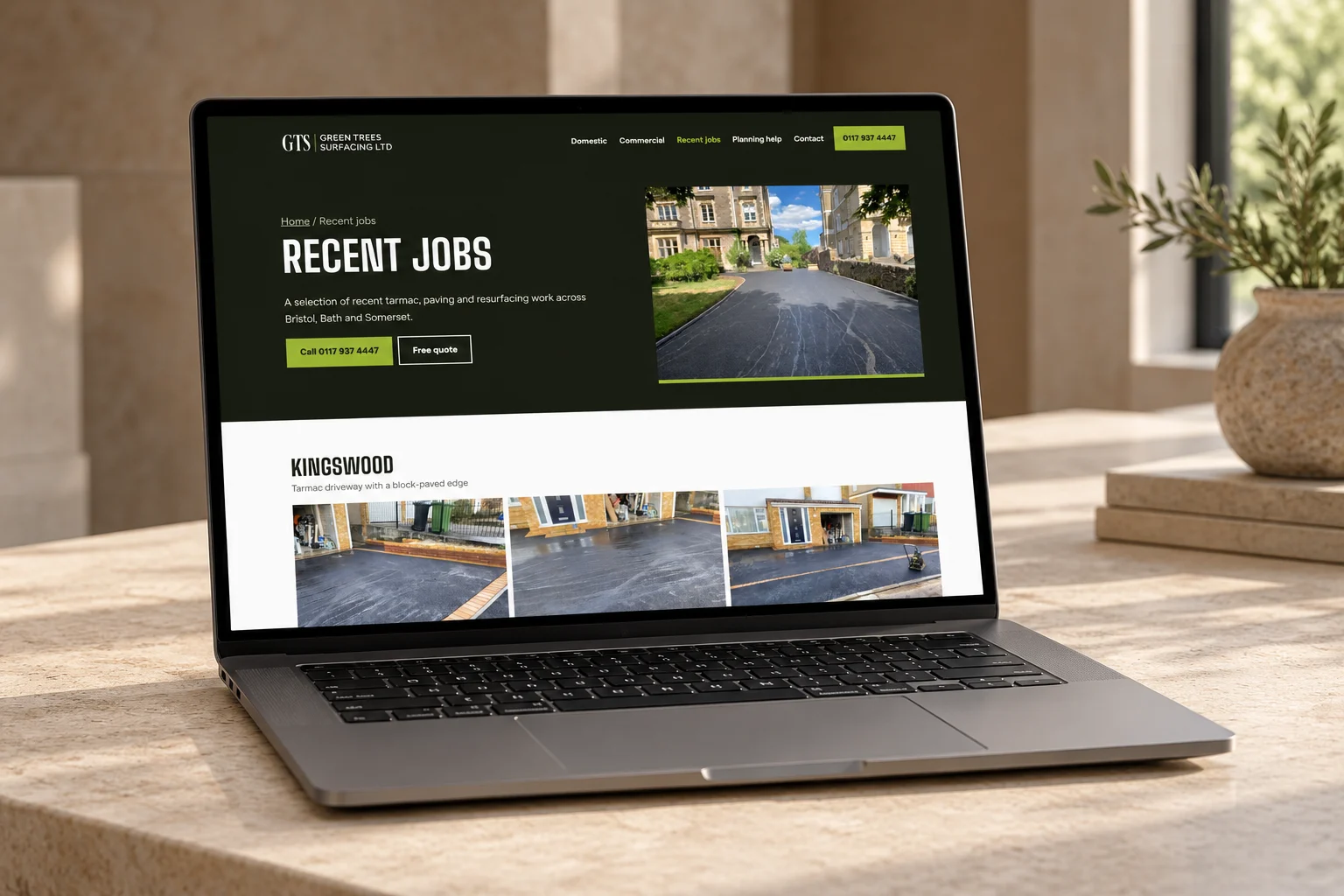 Green Trees Surfacing website shown on a laptop